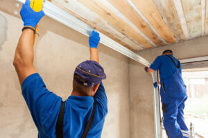 professionals performing garage door service duties