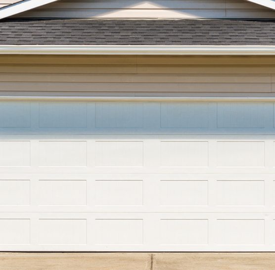 brown home with white garage door